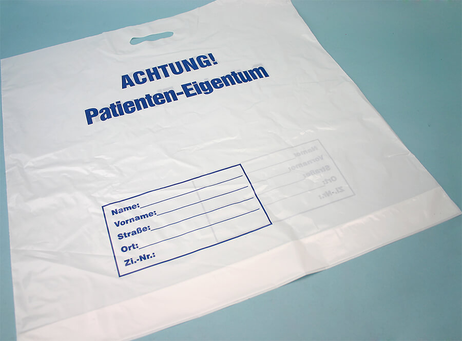 Patiententragetasche weiß mit Aufdruck Eigentum